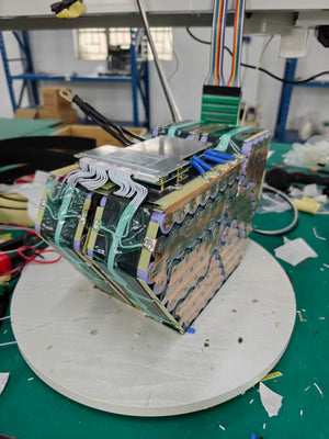 120V 32Ah smart lithium battery featuring a JK active balancing BMS and Bluetooth monitoring.