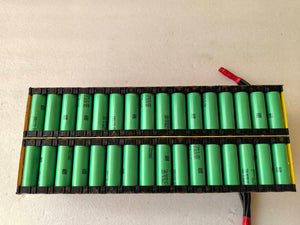High-performance 60V 50Ah SURRON Light Bee upgrade battery manufactured by Chakra Battery, featuring 0.5mm red copper connections between battery cells and an internal cell support bracket